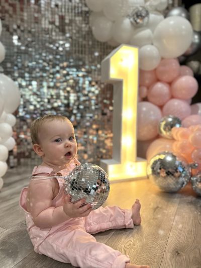 Timeless Party Rentals wedding photo with 'Oh Baby' sign